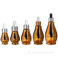 Botellas de cuentagotas de suero de oro esencial cosmético de aceite esencial